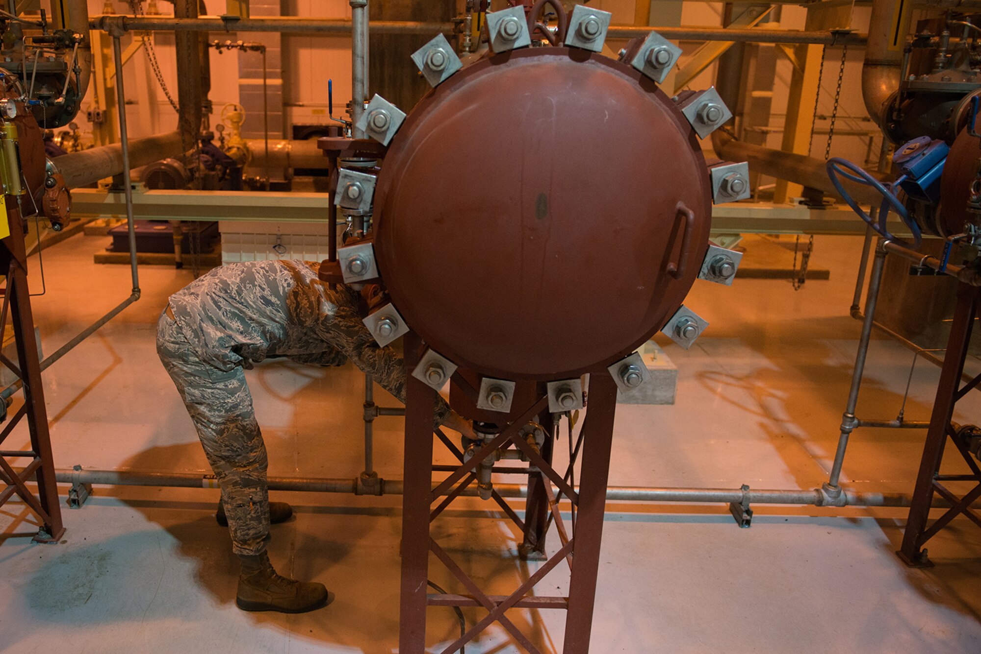 Senior Airman Levi Roark, 673d Logistics Readiness Squadron, fuels distribution journeyman inspects the filter separator at a fuel pump house on the Joint Base Elmendorf-Richardson flightline, July 22. The filter separator removes water and sediment from fuel as it passes through. 
