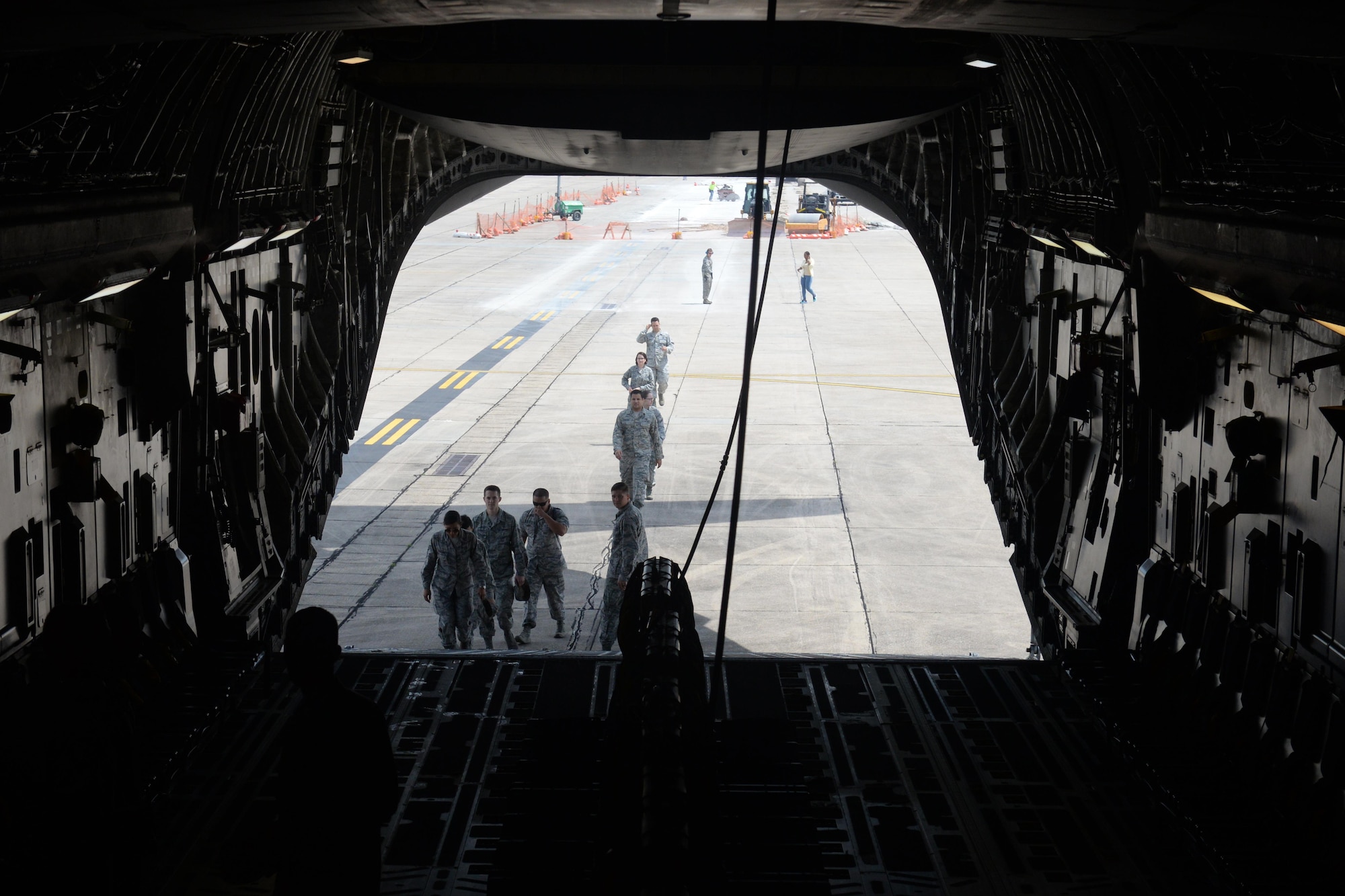 Members of Keesler Air Force Base board a C-17 Globemaster III for an incentive flight Aug. 4, 2016, at Keesler AFB, Miss. The incentive flight was part list of a weeklong hurricane exercise to prepare Keesler for the current hurricane season.  (Air Force Photo by Airman 1st Class Travis Beihl/Released)
