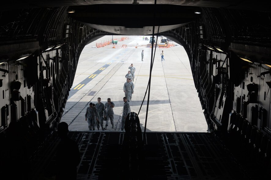 Members of Keesler Air Force Base board a C-17 Globemaster III for an incentive flight Aug. 4, 2016, at Keesler AFB, Miss. The incentive flight was part list of a weeklong hurricane exercise to prepare Keesler for the current hurricane season.  (Air Force Photo by Airman 1st Class Travis Beihl/Released)
