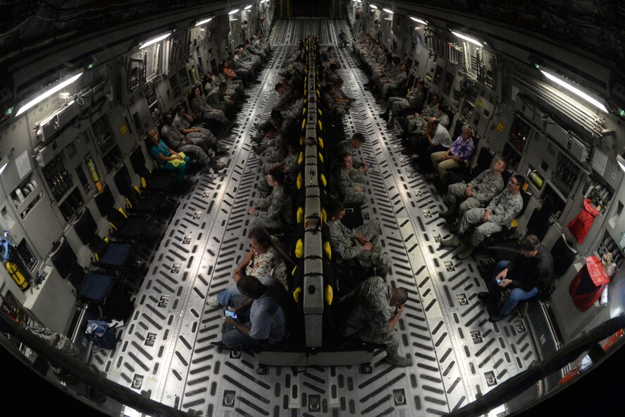 Members of Keesler Air Force Base wait for takeoff on a C-17 Globemaster III during an incentive flight Aug. 4, 2016, at Keesler AFB, Miss. The incentive flight was part of a weeklong hurricane exercise to prepare Keesler for the current hurricane season. (Air Force Photo by Airman 1st Class Travis Beihl/Released)