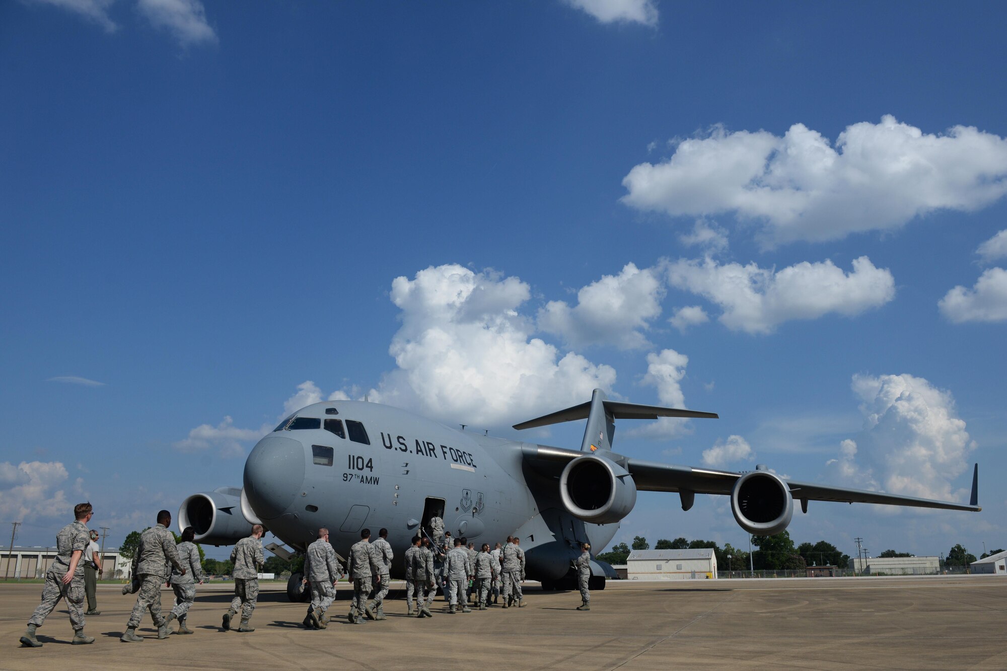 Members of Keesler Air Force Base board a C-17 Globemaster III for an incentive flight Aug. 4, 2016, at Fort Polk, La. The incentive flight was part of a weeklong hurricane exercises to prepare Keesler for the current hurricane season.  (Air Force Photo by Airman 1st Class Travis Beihl/Released)