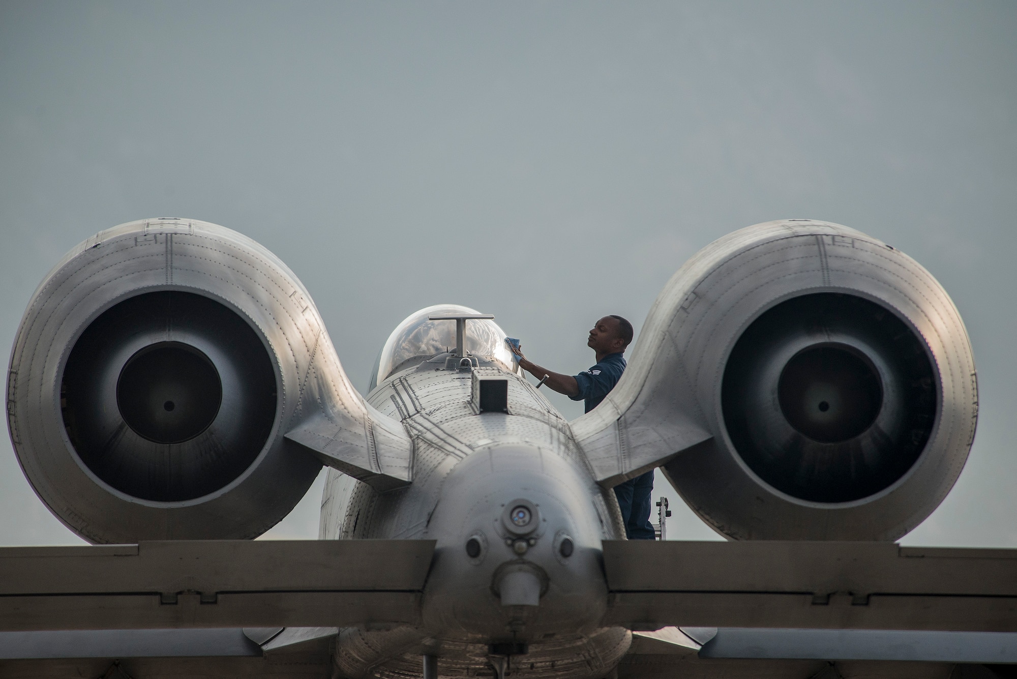 Senior Airman Lavonce Soles, 23rd Aircraft Maintenance Squadron, Moody Air Force Base, Ga., cleans the canopy on an A-10 Thunderbolt II aircraft before flight Aug. 3 at Hill AFB. Moody Airmen and aircraft are at Hill participating in a combat exercise known as Combat Hammer. (U.S. Air Force photo by Paul Holcomb)