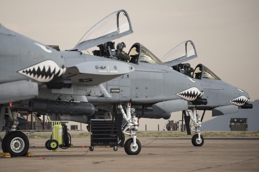 A-10 Thunderbolt II aircraft pilots from Moody Air Force Base, Ga., prepare for flight Aug. 3 at Hill AFB. Moody Airmen and aircraft are at Hill participating in a combat exercise known as Combat Hammer. The exercise evaluates the performance of precision weapons and measures their suitability for use in combat. (U.S. Air Force photo by Paul Holcomb)