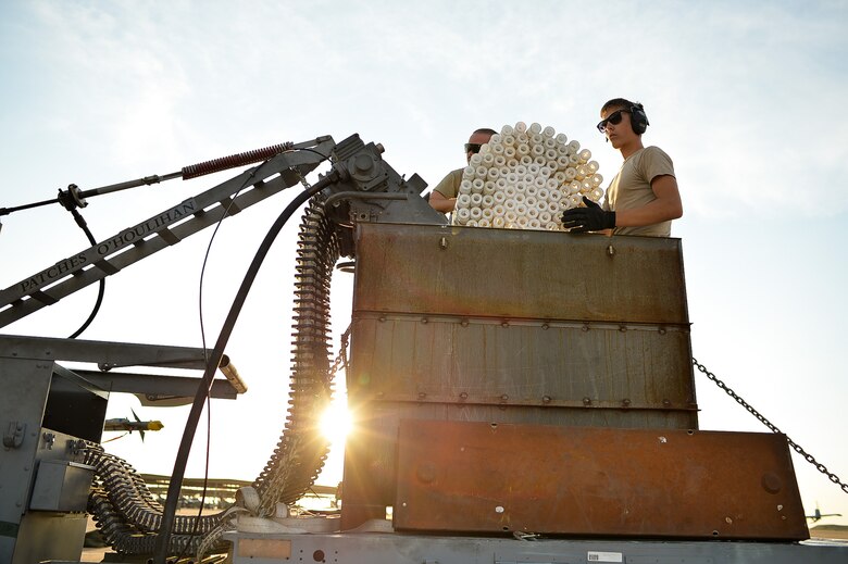 Senior Airman David Vance, left, and Airman 1st Class Tyler Thorne, both assigned to the 23rd Aircraft Maintenance Squadron, Moody Air Force Base, Ga., prepare to offload 30 mm shells from an A-10 Thunderbolt II aircraft Aug. 3 at Hill AFB. Moody Airmen and aircraft are at Hill participating in a combat exercise known as Combat Hammer. (U.S. Air Force photo by R. Nial Bradshaw)