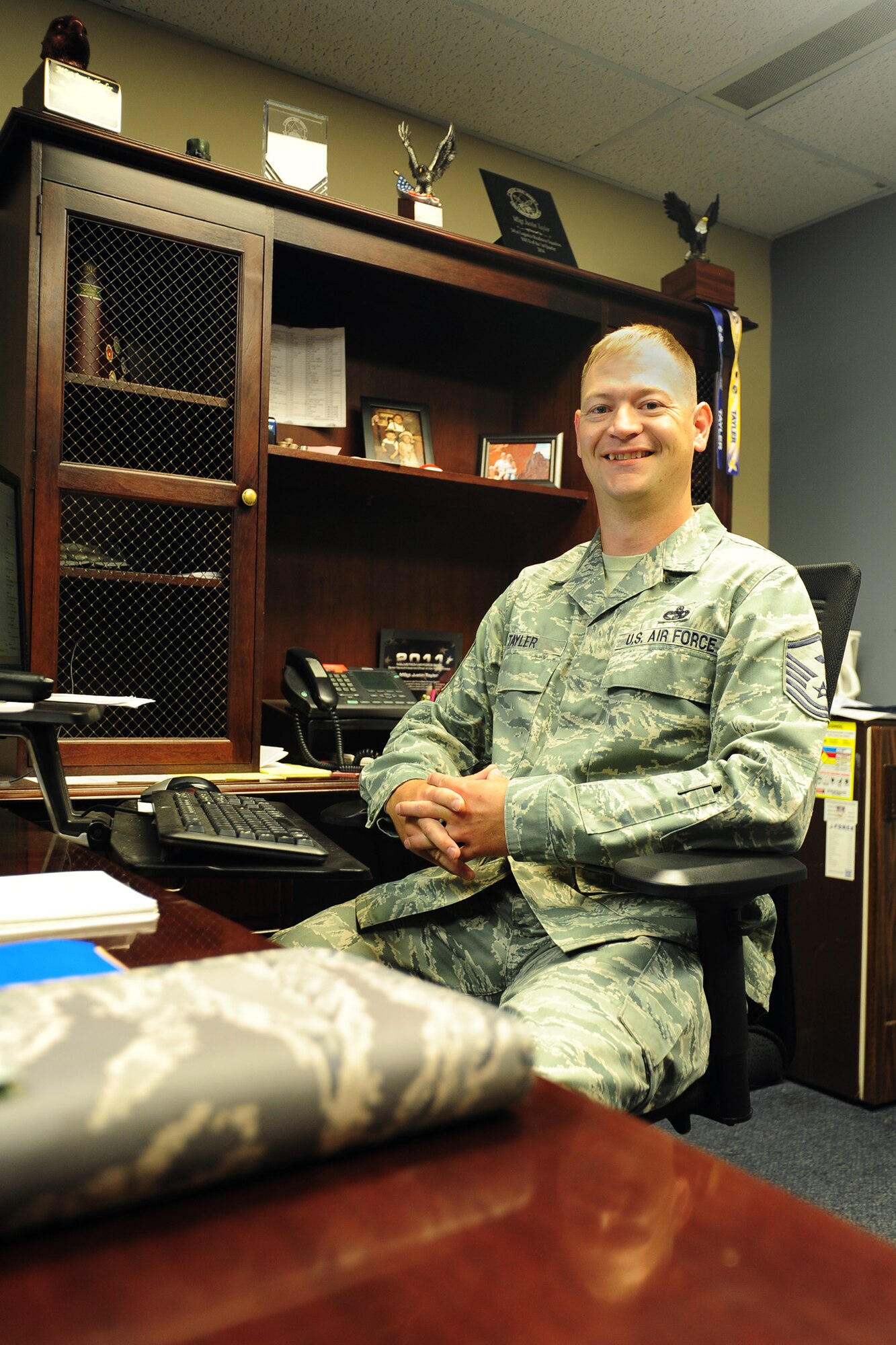 Master Sgt. Justin Tayler, 341st Missile Wing Staff Agency and Operations Group first sergeant, poses in his office Aug. 1, 2016, at Malmstrom Air Force Base, Mont. The first sergeant’s role in the Air Force is one that is time-honored, rich in customs and traditions; they derive authority from unit commanders and are a critical link in providing a mission-ready enlisted force. (U.S. Air Force photo/2nd Lt. Annabel Monroe)