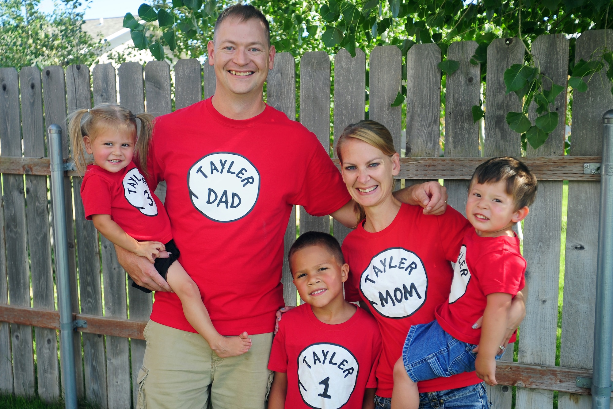 Master Sgt. Justin Tayler, 341st Missile Wing Staff Agency and Operations Group first sergeant; Lori Tayler, wife and mother; and their children pose at an adoption celebration in Great Falls, Mont., July 30, 2016. In total, the Tayler family has fostered 10 children and adopted three. (U.S. Air Force photo/2nd Lt. Annabel Monroe)