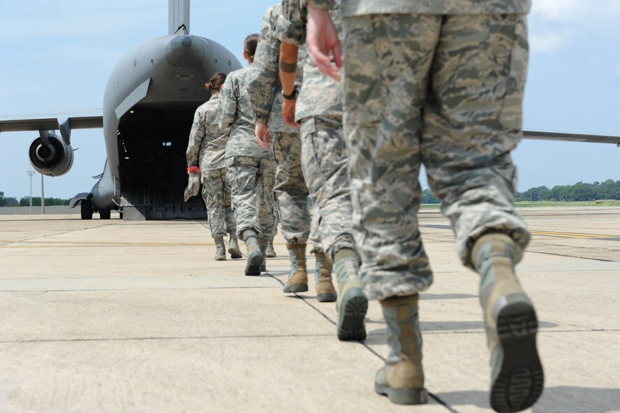 Keesler personnel board a C-17 Globemaster III from Altus Air Force Base, Okla. for evacuation during a hurricane exercise Aug. 4, 2016, on Keesler Air Force Base, Miss. The purpose of the exercise was to prepare Keesler for the current hurricane season. (U.S. Air Force photo by Kemberly Groue/Released)