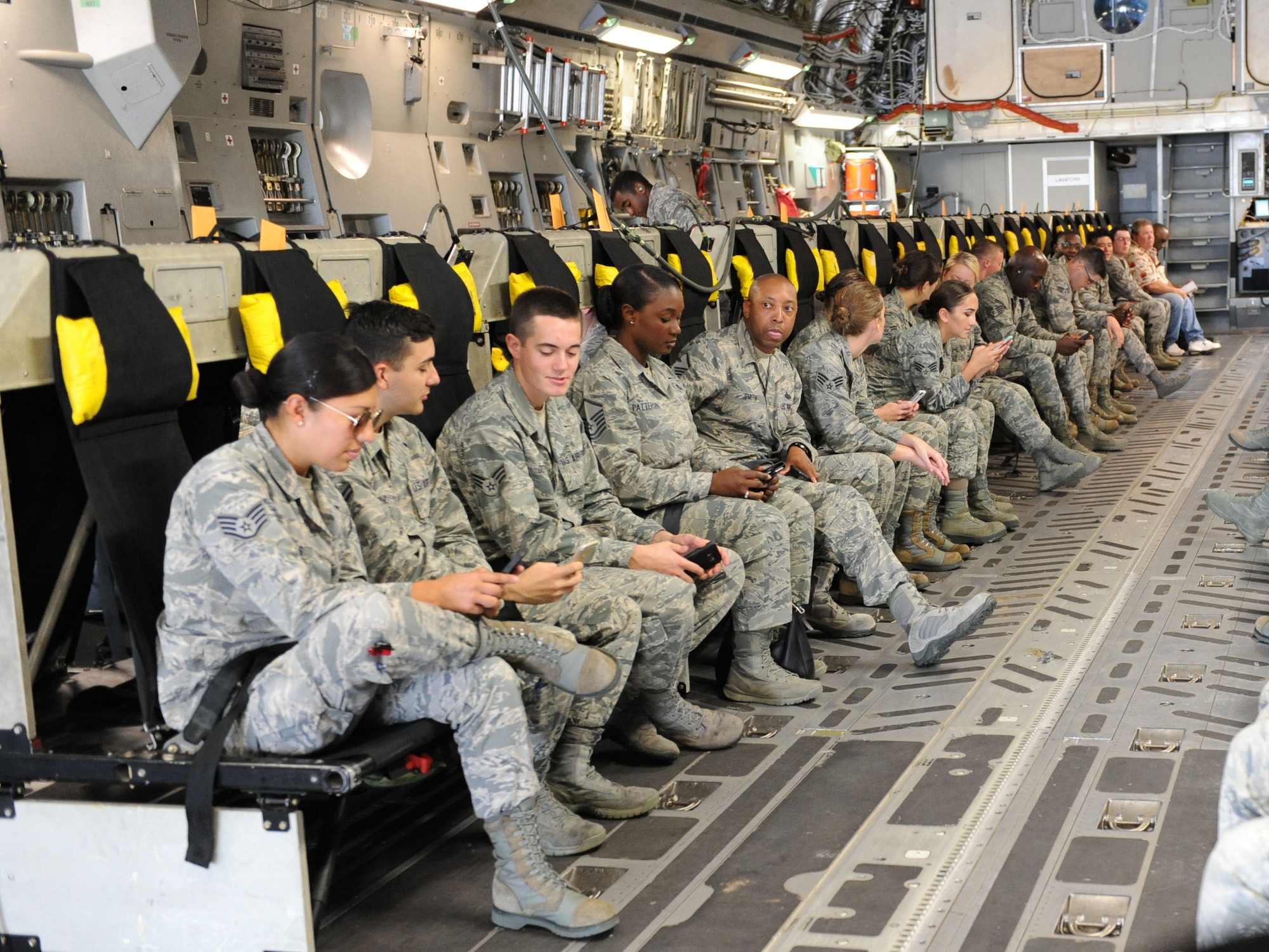 Keesler personnel sit aboard a C-17 Globemaster III from Altus Air Force Base, Okla. for evacuation during a hurricane exercise Aug. 4, 2016, on Keesler Air Force Base, Miss. The purpose of the exercise was to prepare Keesler for the current hurricane season. (U.S. Air Force photo by Kemberly Groue/Released)