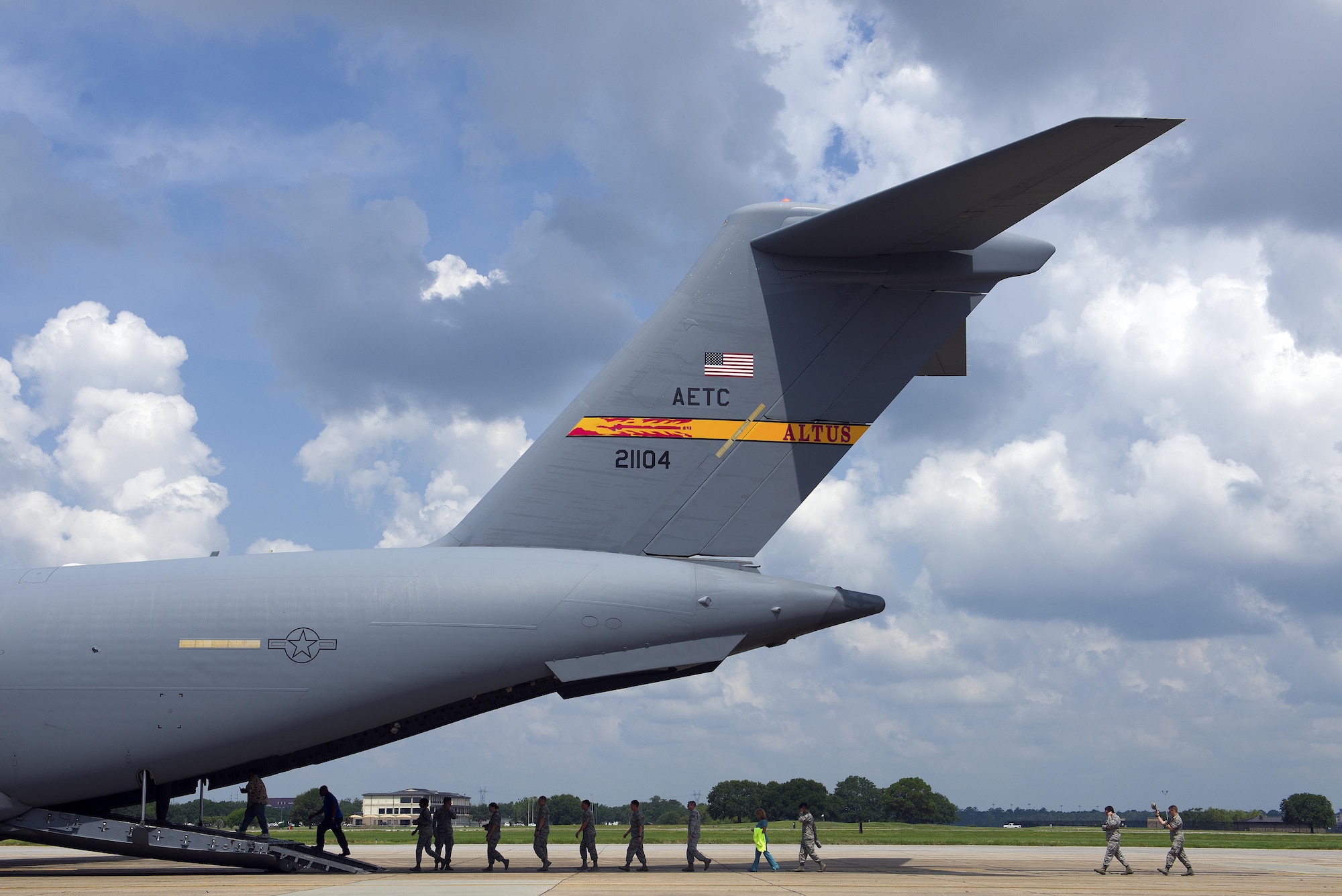 Airmen and civilians assigned to Keesler Air Force Base, Miss., board a C-17 Globemaster III from Altus Air Force Base, Okla., for an incentive flight Aug. 4, 2016, on Keesler Air Force Base, Miss. The incentive flight was part of a weeklong hurricane exercise to prepare Keesler for the current hurricane season. (U.S. Air Force photo by Senior Airman Duncan McElroy/Released)