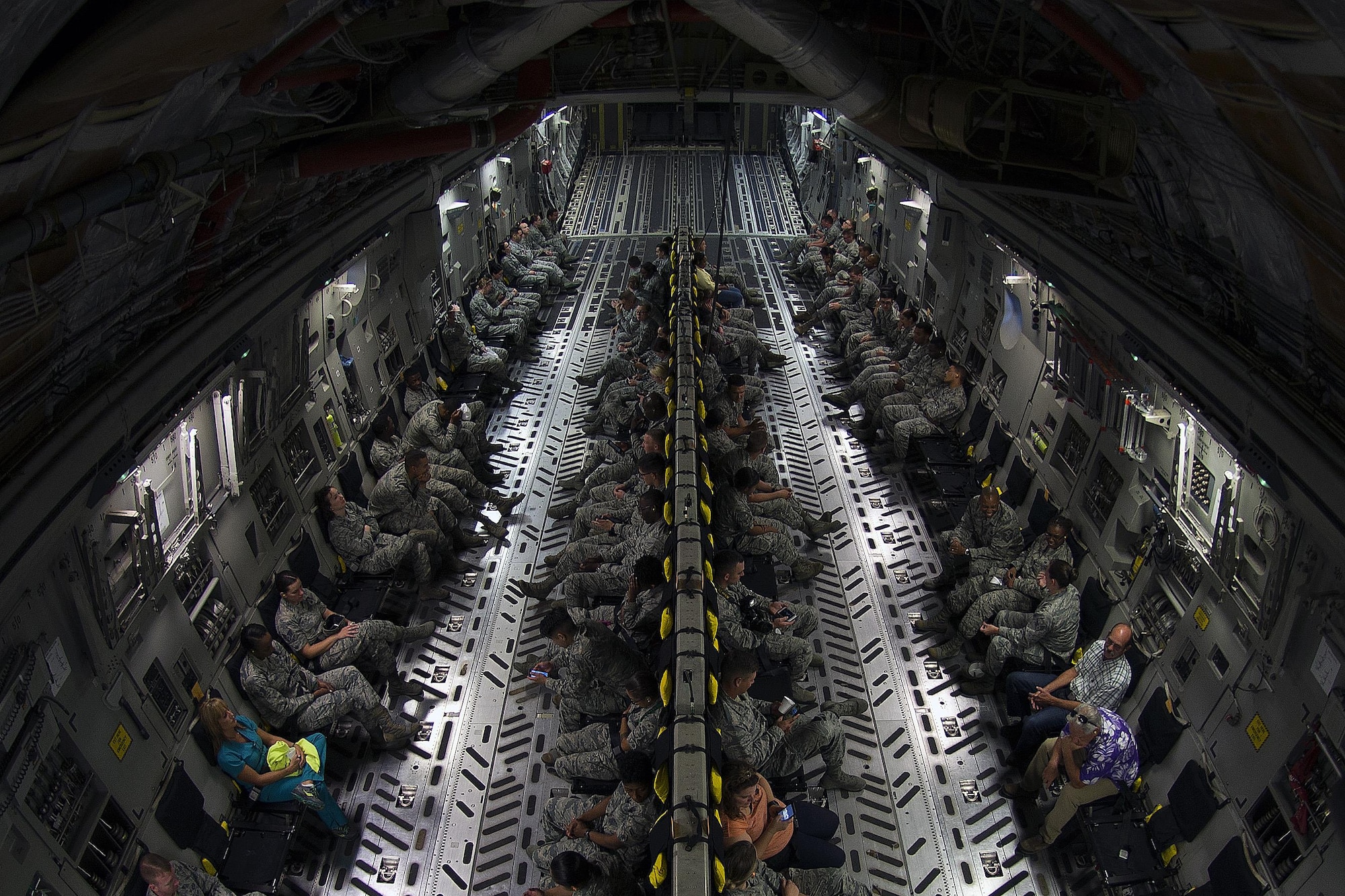 Airmen and civilians assigned to Keesler Air Force Base, Miss., participate in an incentive flight aboard a C-17 Globemaster III from Altus Air Force Base, Okla., Aug. 4, 2016. The incentive flight was part of a weeklong hurricane exercise to prepare Keesler for the current hurricane season. (U.S. Air Force photo by Senior Airman Duncan McElroy/Released)