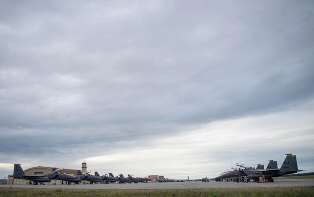 U.S. Air Force F-15E Strike Eagle fighter aircraft assigned to the 336th Fighter Squadron, Seymour Johnson Air Force Base, N.C., wait along with U.S. Navy EA-18G Growler aircraft assigned to the Electronic Attack Squadron 135, Naval Air Station Whidbey Island, Wash. as Royal Canadian Air Force CF-18 Hornet aircraft assigned to the 409th Tactical Fighter Squadron, Canadian Forces Base Cold Lake, Canada, in front of the Thunder Dome Aug. 5, 2016, at Eielson Air Force Base, Alaska, prior to a familiarization sortie for RED FLAG-Alaska (RF-A) 16-3. RF-A exercises provide U.S. and allied pilots, aircrews and operational support personnel the opportunity to train and improve their air combat skills in preparation for a myriad of worldwide contingencies. (U.S. Air Force photo by Staff Sgt. Shawn Nickel)