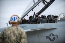 U.S. Navy pilots and a crew chief assigned to the Electronic Attack Squadron 135, Naval Air Station Whidbey Island, Wash., prepare an EA-18G Growler aircraft for take off, Aug. 5, 2016, at Eielson Air Force Base, Alaska, during the familiarization day of RED FLAG-Alaska (RF-A) 16-3.  Free exchange of ideas between multilateral forces during RF-A enhances not just partners and sister-service relationships, but also their operational efficiency. (U.S. Air Force photo by Staff Sgt. Shawn Nickel)