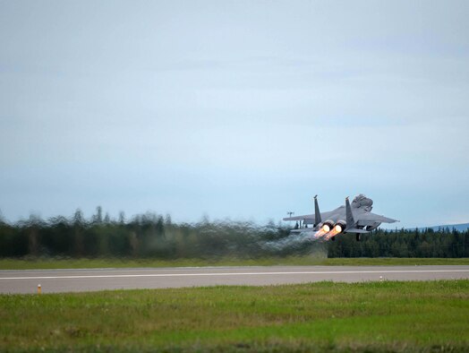 A U.S. Air Force F-15E Strike Eagle dual-role fighter aircraft assigned to the 336th Fighter Squadron, Seymour Johnson Air Force Base, N.C., takes off Aug. 5, 2016, at Eielson Air Force Base, Alaska, during a familiarization flight for RED FLAG-Alaska (RF-A) 16-3. RF-A provides training for deployed maintenance and support personnel in sustainment of large-force deployed air operations. (U.S. Air Force photo by Staff Sgt. Shawn Nickel)