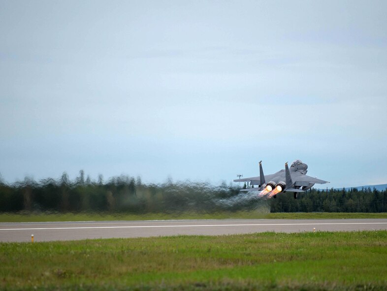 A U.S. Air Force F-15E Strike Eagle dual-role fighter aircraft assigned to the 336th Fighter Squadron, Seymour Johnson Air Force Base, N.C., takes off Aug. 5, 2016, at Eielson Air Force Base, Alaska, during a familiarization flight for RED FLAG-Alaska (RF-A) 16-3. RF-A provides training for deployed maintenance and support personnel in sustainment of large-force deployed air operations. (U.S. Air Force photo by Staff Sgt. Shawn Nickel)