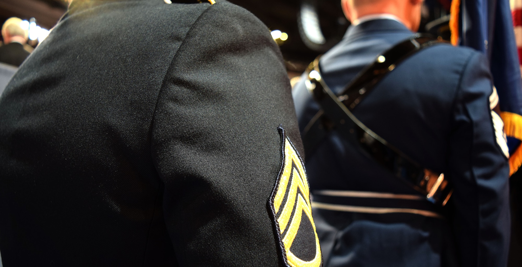 Await their debut at the Democratic National Convention at the Wells Fargo Center in Philadelphia, Pa. July 27, 2016, the black and blue dress uniforms of the Pennsylvania National Guard Honor Guard detail stand ready to present the colors before thousands of conventioneers. (U.S. Air National Guard photo by Master Sgt. Chris Botzum)