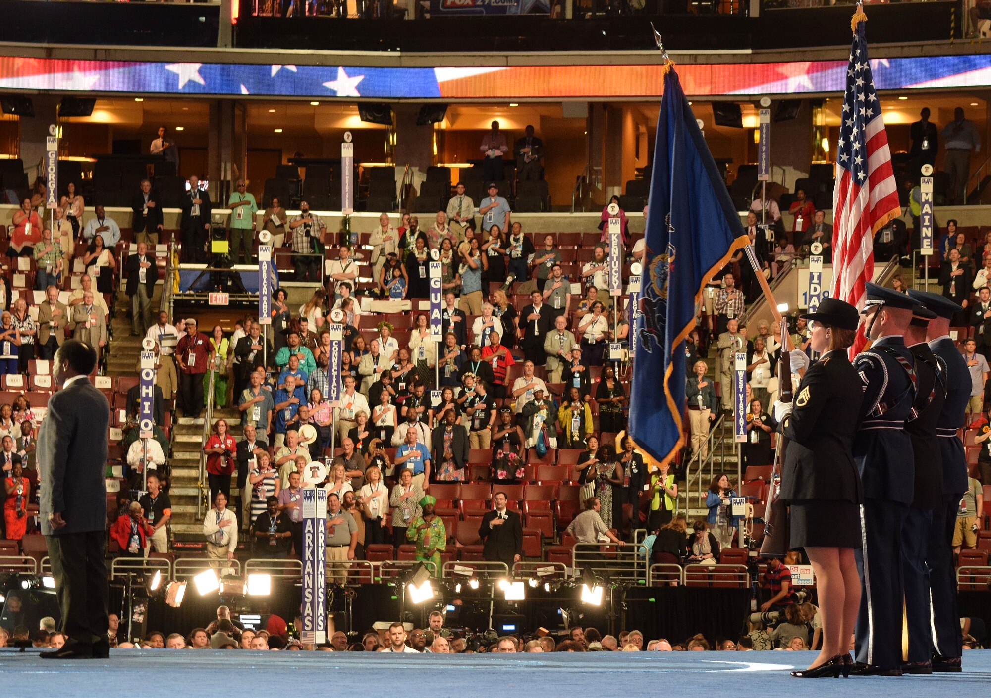 Before thousands of conventioneers at the Democratic National Convention at the Wells Fargo Center in Philadelphia, Pa. July 27, 2016, a dip of the Pennsylvania state flag from the blended service Pennsylvania National Guard Honor Guard detail signals onlookers to recite a heart-felt Pledge of Allegiance. (U.S. Air National Guard photo by Master Sgt. Chris Botzum)