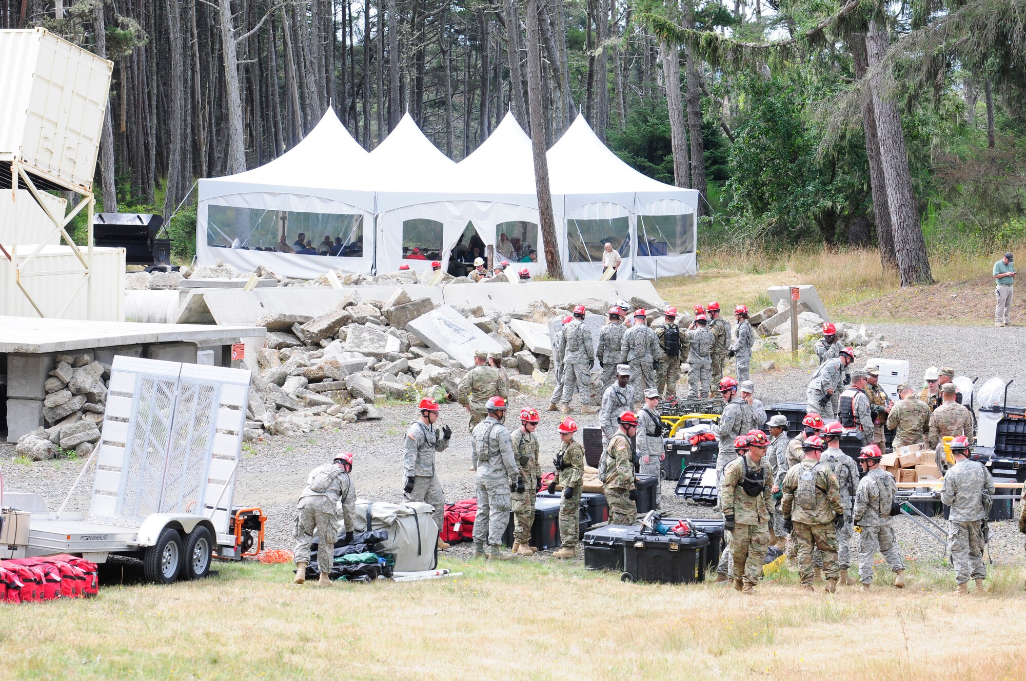 U.S. Colorado National Guard Airmen and Soldiers, assigned to the 140th Wing, Buckley Air Force Base, unload equipment for a joint exercise evaluation (EXEVAL), where they will be evaluated for war time readiness at Camp Rilea in Warrenton, Oregon, on Aug.2, 2016. The EXEVAL ran for five days in a crawl, walk, run sequence, where they started off slow then transitioned into rapid response on evaluation day. (U.S. Air National Guard photo by Staff Sgt. Bobbie Reynolds) 