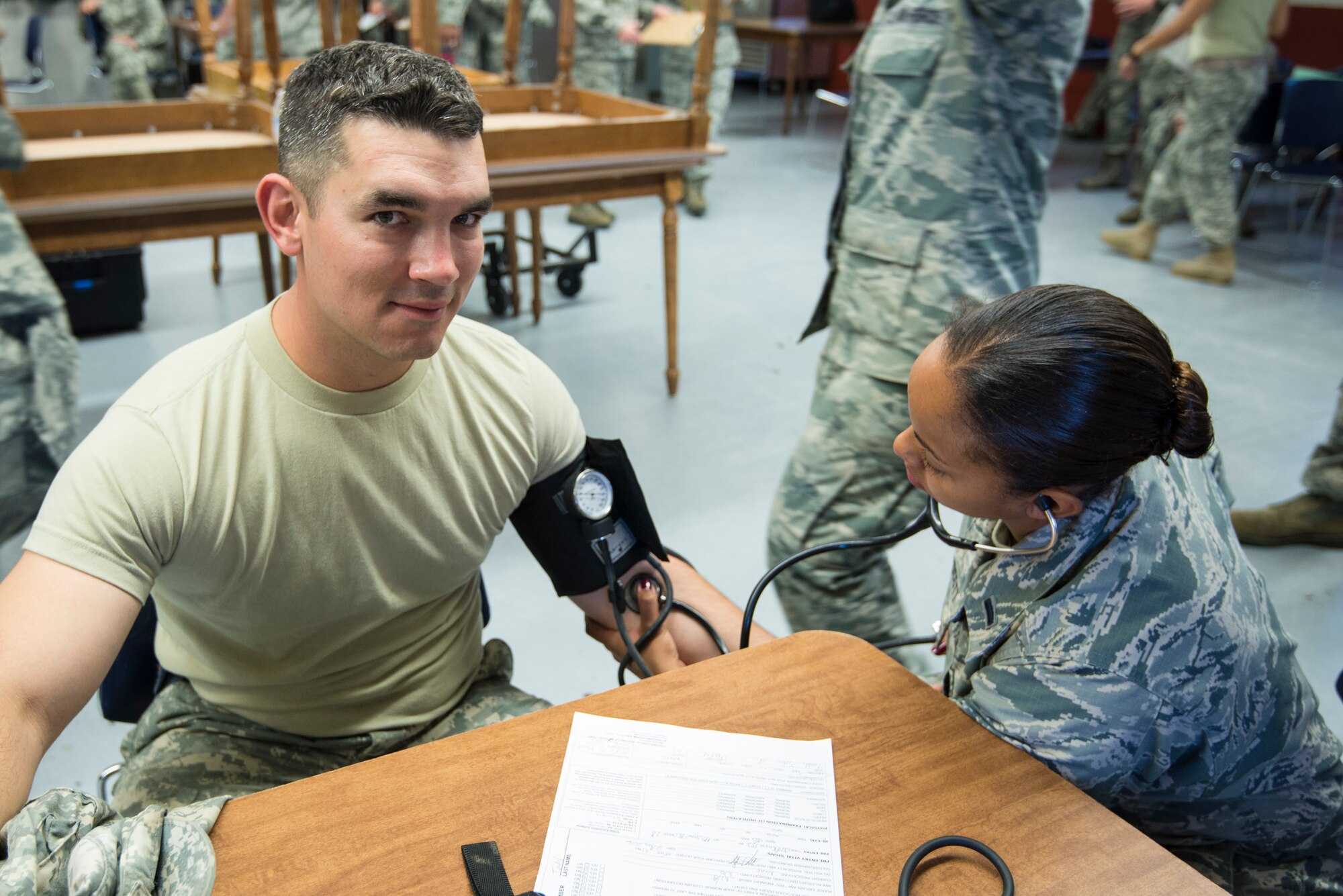 1st Lt. Isis Rojas-Scott, a nurse assigned to the 140th Medical Group, Buckley Air Force Base, takes blood pressure of Soldiers and Airmen participating in the joint exercise evaluation (EXEVAL), where they will be evaluated for war time readiness at Camp Rilea in Warrenton, Oregon, on Aug.2, 2016. The EXEVAL ran for five days in a crawl, walk, run sequence, where they started off slow then transitioned into rapid response on evaluation day. (U.S. Air National Guard photo by Staff Sgt. Bobbie Reynolds)