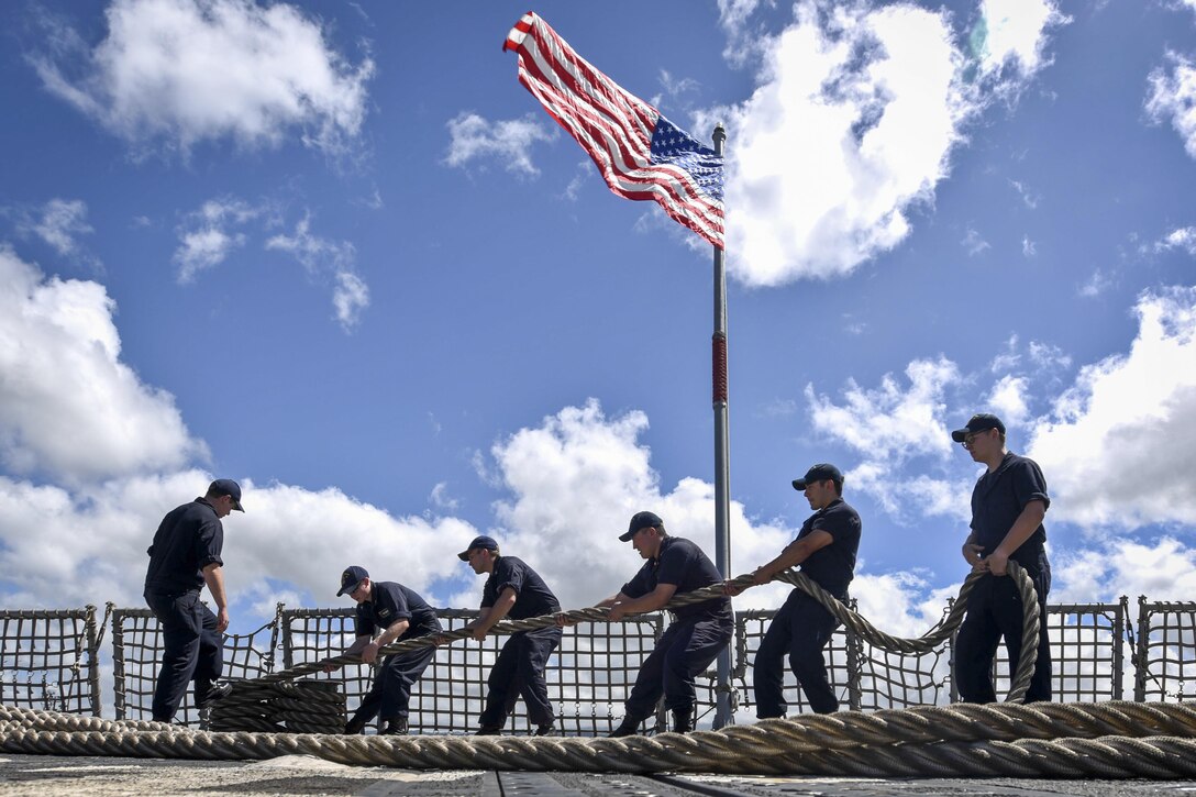 Sailors heave a mooring line as the USS Shoup returns from Rim of the Pacific 2016 to Joint Base Pearl Harbor-Hickam, Hawaii, Aug. 3, 2016. Navy photo by Petty Officer 2nd Class Holly L. Herline