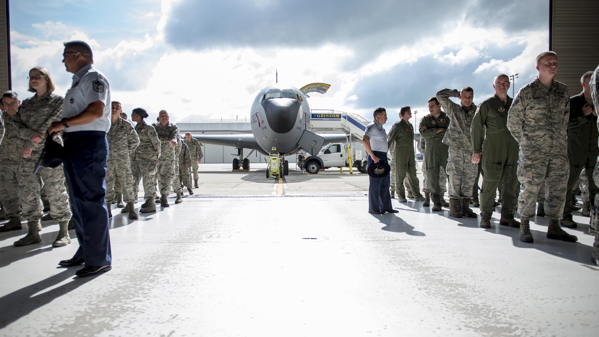 Master Sgt. Carlos Recoder (left) and Tech. Sgt. Jesse Garcia (right), 433rd Training Squadron military training instructors, observe a formation during a 434th Air Refueling Wing change of command ceremony at Grissom Air Reserve Base, Ind., July 9, 2016. Recoder and Garcia visited the base to recruit potential traditional reservists interested in joining the MTI corps. (U.S. Air Force photo/Staff Sgt. Katrina Heikkinen)