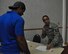 Tech. Sgt. Angelique Brooks, 931st Force Support Squadron NCO in charge of customer support, directs an individual ready reserve member for more information during an IRR muster Aug. 6, 2016, McConnell AFB, Kansas. Each year IRR Airmen report in to update their personal information and receive updates on service-related benefits. (U.S. Air Force Photo by Senior Airman Preston Webb)