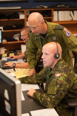Royal Canadian Air Force service members control the Hawaiian airspace from Hawaii Air National Guard facilities during RIMPAC exercises, July 21, 2016. RIMPAC is the world’s largest international maritime exercise. The biennial event took place in the waters and skies around the Hawaiian Islands as well as Southern California. This year’s iteration involved twenty-six nations, five submarines, 45 ships, and over 200 aircraft. (Air National Guard photo by Airman 1st Class Robert Cabuco/released) 