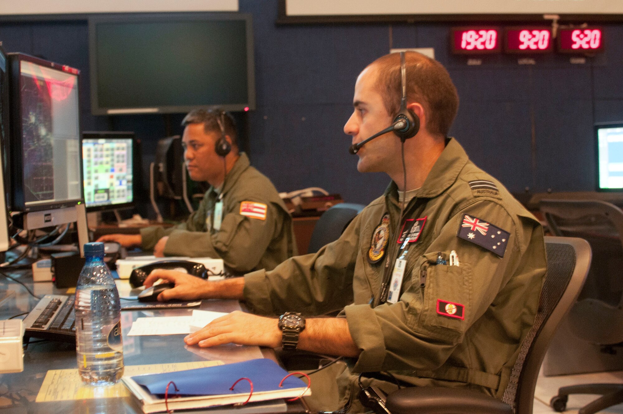 Royal Australian Air Force service members control the airspace with Hawaii Air National Guard airmen from HIANG facilities during RIMPAC 2016, July 21, 2016. The participating nations and forces exercised a wide range of capabilities and demonstrated the inherent flexibility of maritime forces. The relevant, realistic training program includes amphibious operations, gunnery, missile, anti-submarine and air defense exercises. (Air National Guard photo by Airman 1st Class Robert Cabuco/released) 
