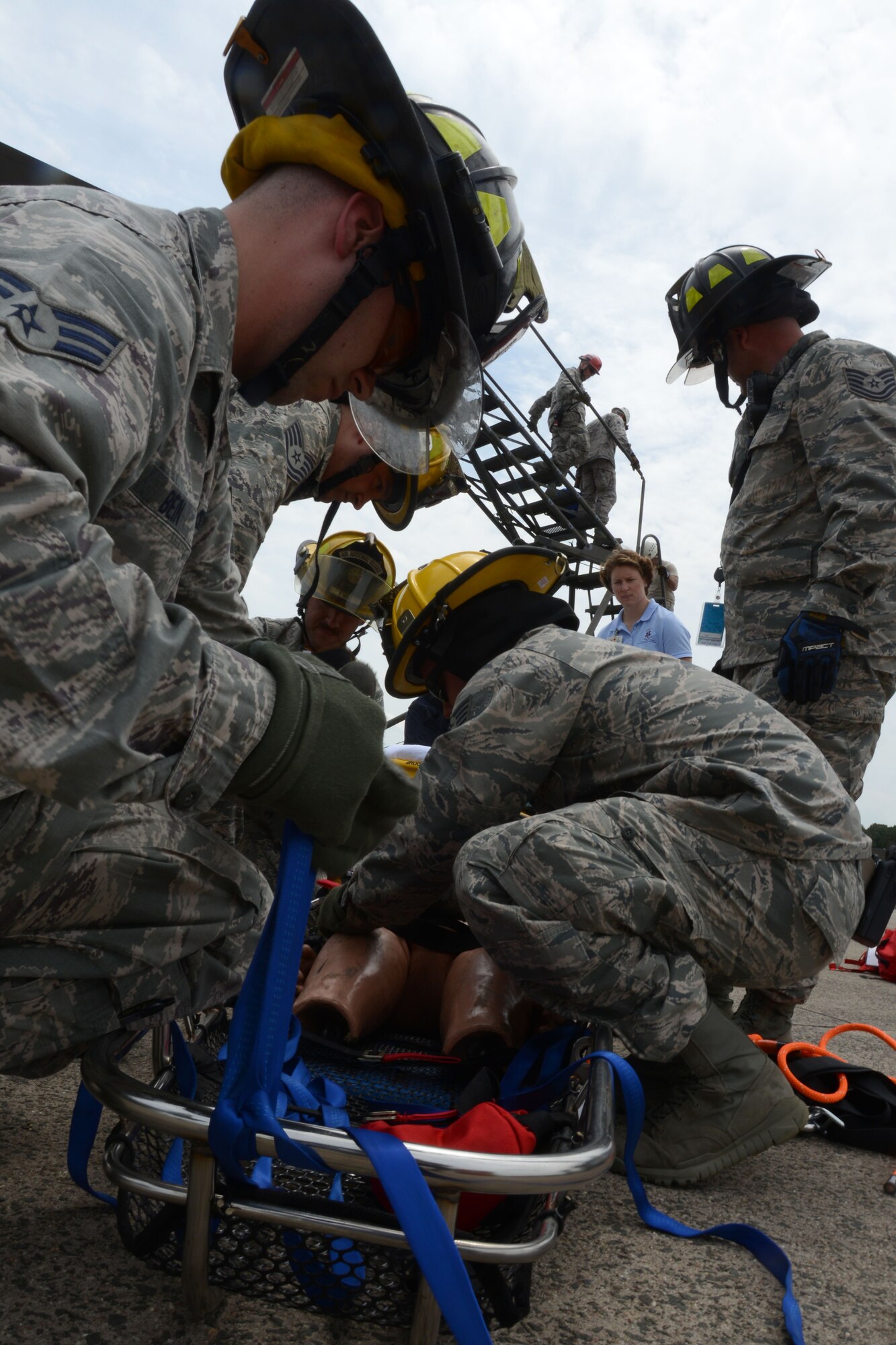 During the 103rd Airlift Wing’s June training assembly, first responders from Bradley International Airport and Connecticut State Police aided 103rd Maintenance Group fuel systems maintenance personnel in a confined space exercise. The exercise featured a simulation of an individual who needed to be rescued from the fuel bay of a C-130 Hercules. (U.S. Air National Guard photo by Senior Airman Emmanuel Santiago)