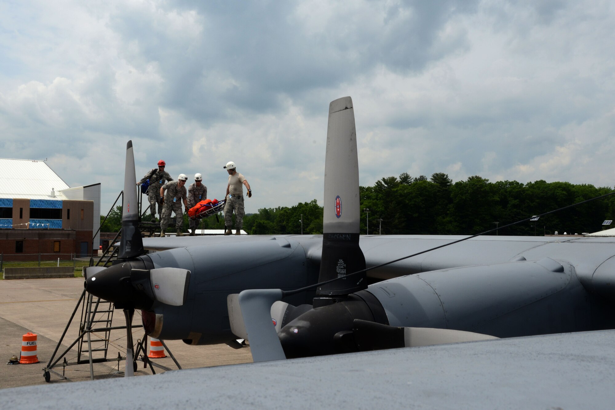 During the 103rd Airlift Wing’s June training assembly, first responders from Bradley International Airport and Connecticut State Police aided 103rd Maintenance Group fuel systems maintenance personnel in a confined space exercise. The exercise featured a simulation of an individual who needed to be rescued from the fuel bay of a C-130 Hercules. (U.S. Air National Guard photo by Senior Airman Emmanuel Santiago)