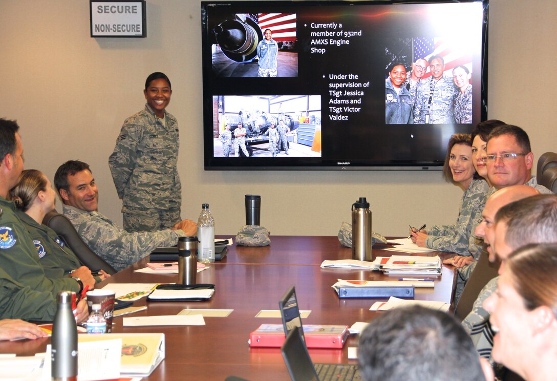Spotlight:  Senior Airman Debra Gomez (standing at left), is a member of the 932nd Airlift Wing and works in the 932nd Maintenance Group's engine shop, part of the AMXS.  She spoke to the pre-Unit Training Assembly commander's leadership staff to explain why she joined the unit, the work she does for Air Force Reserve Command in Illinois, and what she likes about serving.  She noted a desire to find a career with a higher purpose and a family history of service influencing her decisions to sign up, and she also credited Tech Sgt. Jessica Adams and Tech. Sgt. Victor Valdez as supervisors who have helped her along the way.  (U.S. Air Force photo by Maj. Stan Paregien)