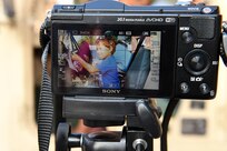 A photo of Santi, 4, is composed while he sits in the driver seat of a Humvee during Arlington Heights' National Night Out on Aug. 2, 2016. National Night Out is a local police community event across the U.S. and Canada on the second Tuesday of every August. 
(Photo by Sgt. Aaron Berogan)