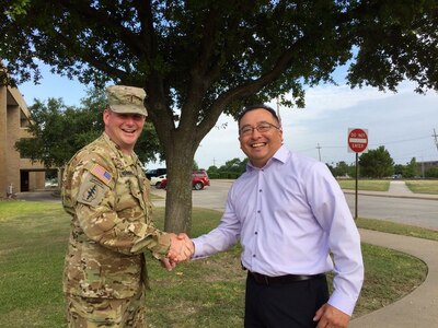 Mr. Juan Alvarez, Safety and Occupational Health Specialist, 85th Support Command, receives a coin from the 120 Infantry Brigade for his support and assistance during an Organizational Inspection Program visit at Fort Hood, Texas on July 28, 2016.
(Photo by Mr. Anthony L. Taylor)