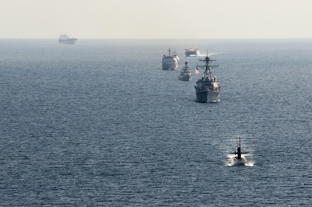 Ships taking part in the Cooperation Afloat Readiness and Training (CARAT) Indonesia 2016 exercise maneuver into formation in the Java Sea, Aug. 6, 2016. CARAT is a series of annual maritime exercises involving the U.S. Navy, U.S. Marine Corps and the armed forces of nine partner nations. Navy photo by Mass Communication Specialist 2nd Class Will Gaskill

