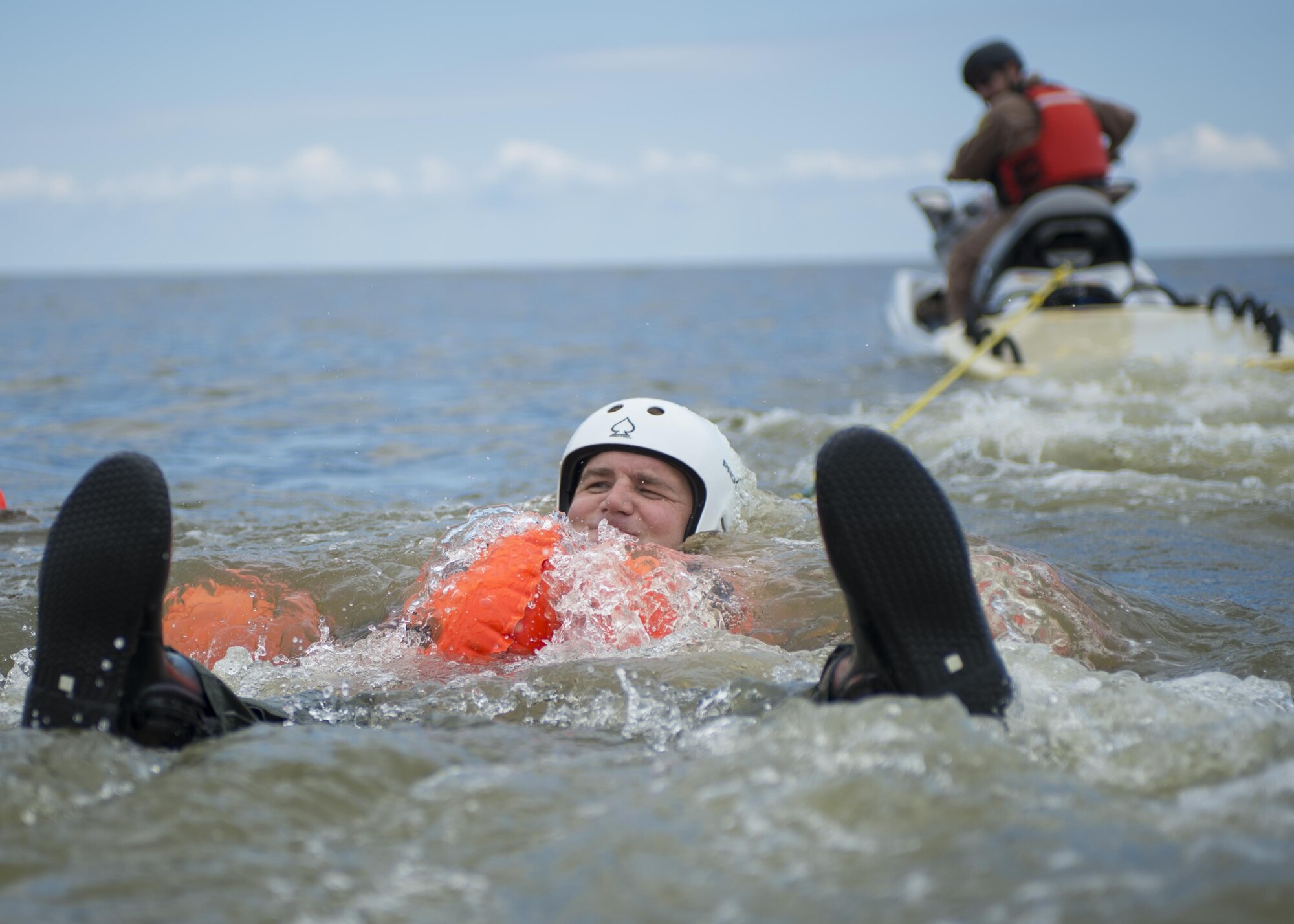 Tech. Sgt. Marc Dougherty, 326th Airlift Squadron loadmaster, drags behind a jet ski before he releases his line Aug. 5, 2016, Bowers Beach, Del. Dougherty was performing water survival training that must be completed every three years. (U.S. Air Force Photo/ Tech. Sgt. Nathan Rivard)