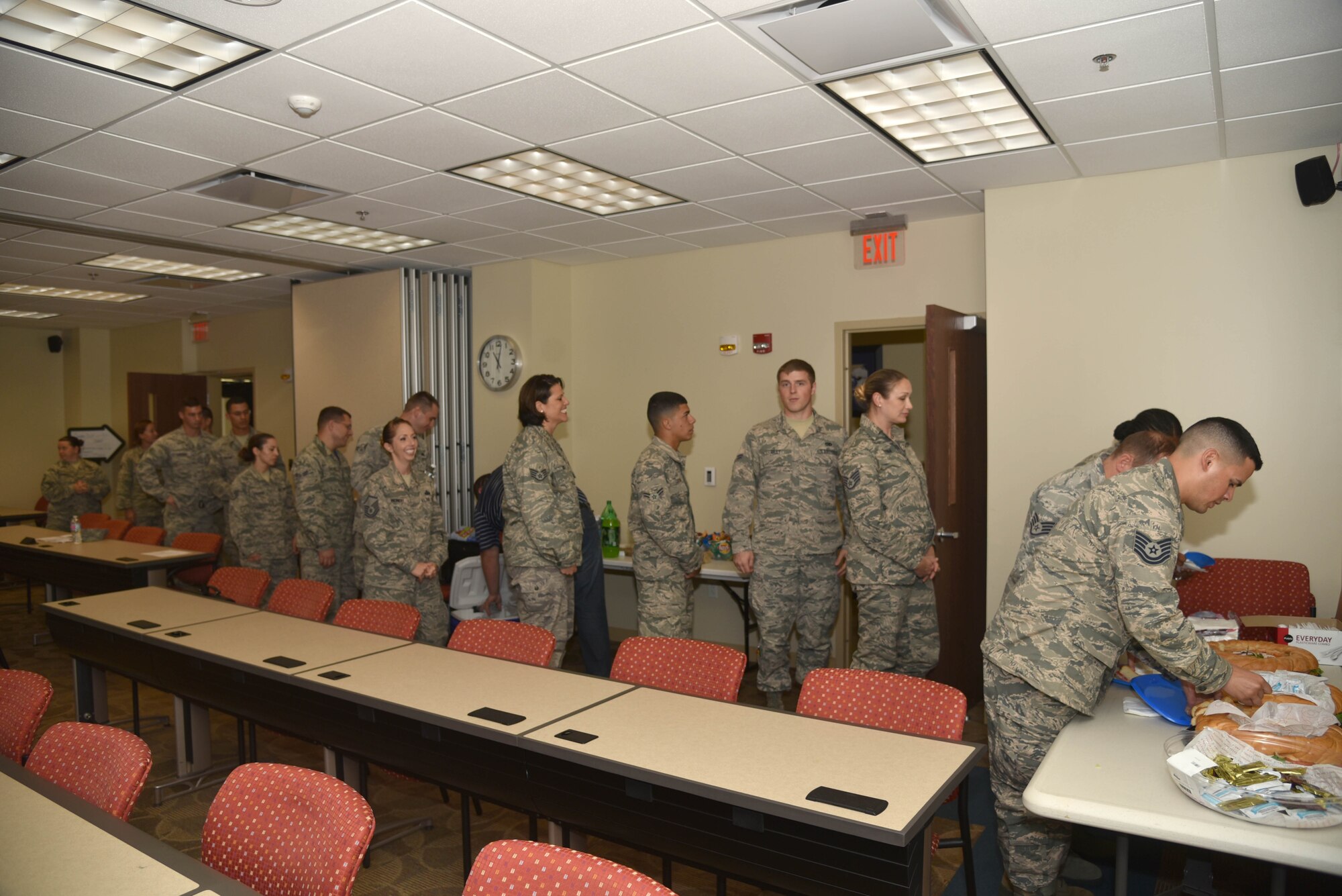 Airmen go through the food line during a lunch and learn workshop event put on by members of the Top Three at MacDill Air Force Base, FL on Aug. 7. This workshop included topics such as home buying, credit management and other fiscal responsibilities, aimed at making a difference in the lives of the reservists. (U.S. Air Force photo by Senior Airman Xavier Lockley)