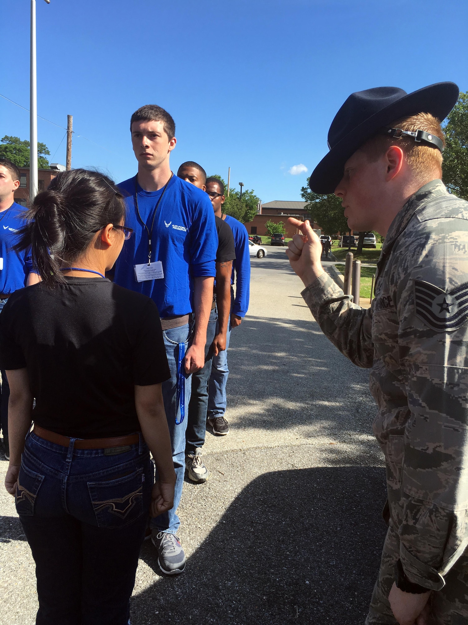 Technical Sgt. Matthew Jordan, unit training manager for the 69th Aerial Port Squadron, and former military training instructor, corrects a trainee during a drill and ceremony class for the Development and Training Flight, Joint Base Andrews, Md., July 10, 2016. Jordan worked as an MTI for five years and trained 25 flights of new Airmen before coming to the Reserve. (U.S. Air Force photo/2nd Lt. Katie Spencer)