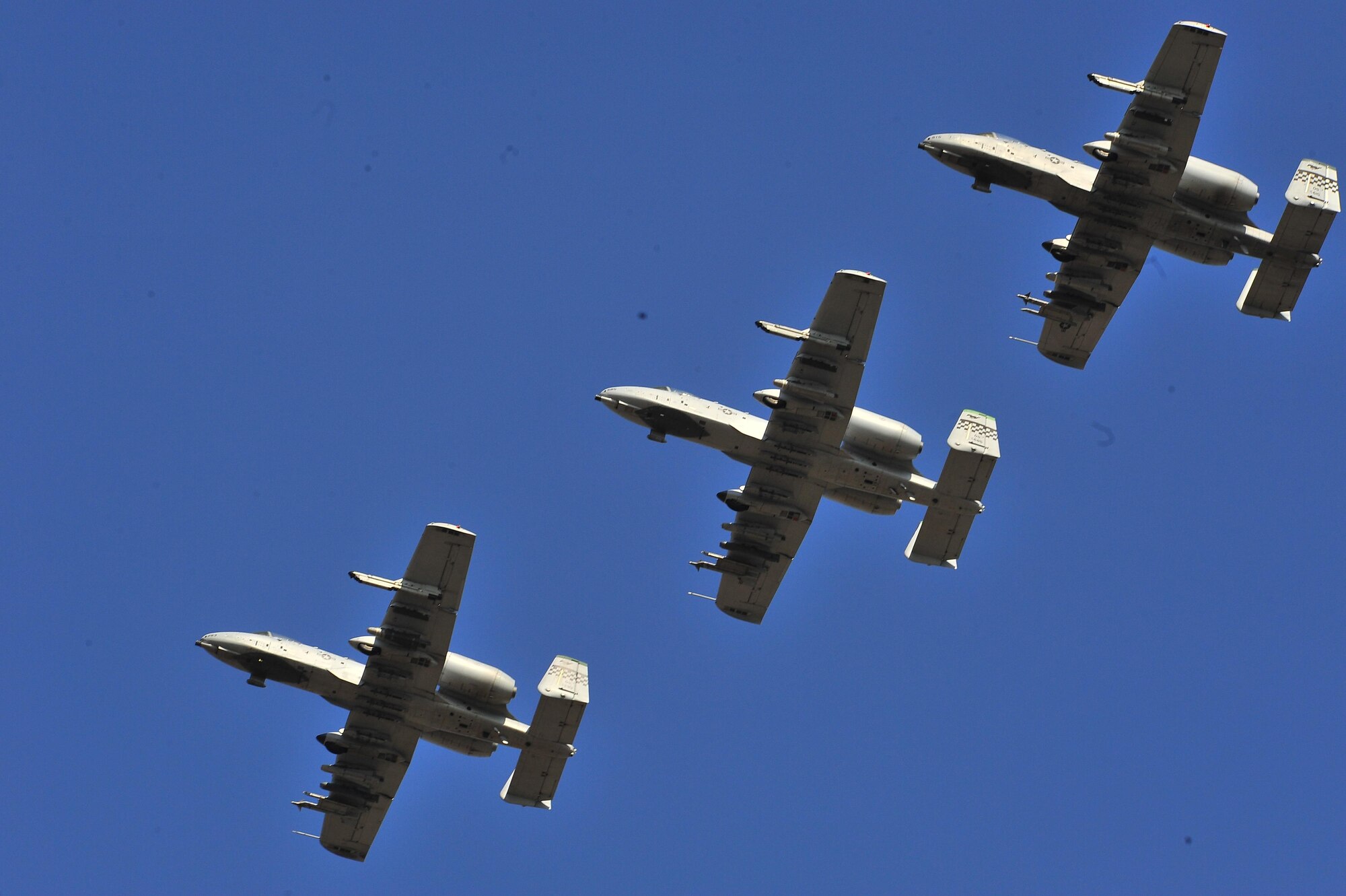 Three A-10 Thunderbolt IIs assigned to the 25th Fighter Squadron perform a flyover during Air Power Day 2011 at Osan Air Base, Republic of Korea. Air Power Day 2016 will include performances from A-10s and F-16 Flying Falcons assigned to Osan in additions to multiple other acts and static displays. (U.S. Air Force courtesy photo/released)
