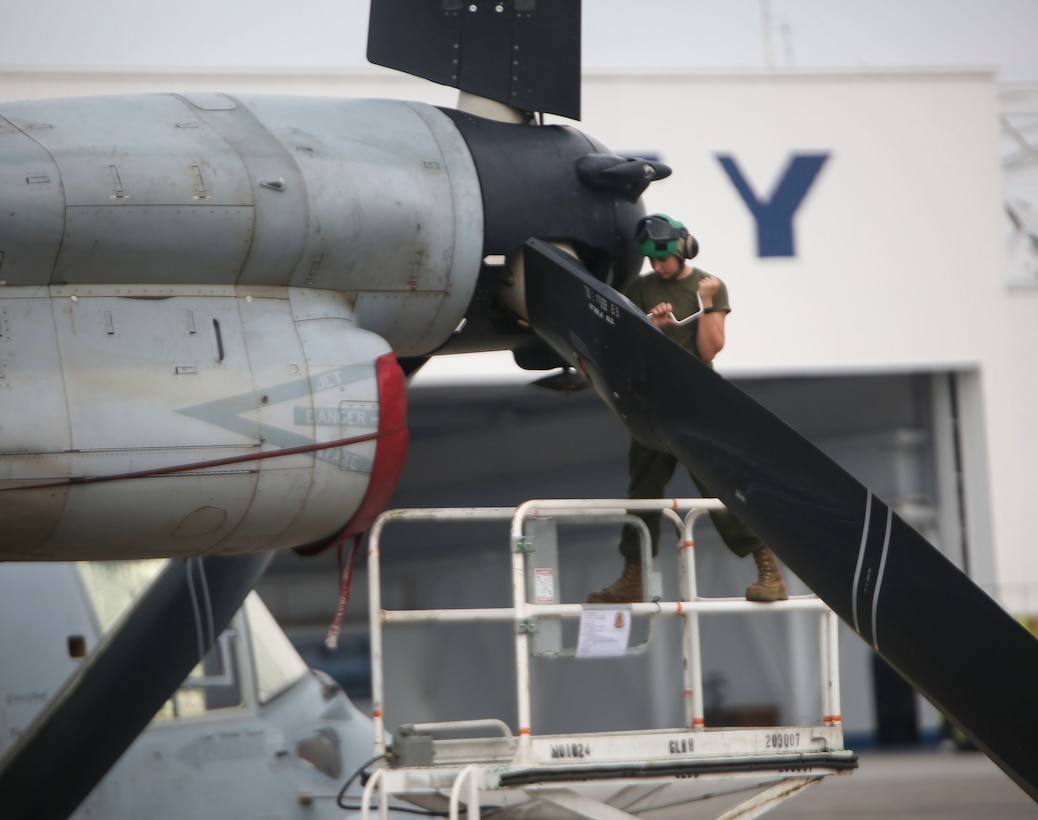 CLARK AIR BASE, Philippines — Lance Cpl. Samantha Lenz, a flight line mechanic assigned to Marine Medium Tiltrotor Squadron 265, Marine Aircraft Group 36, 1st Marine Aircraft Wing, III Marine Expeditionary Force, works on an MV-22B Osprey at Clark Air Base in the Philippines in preparation for Air Assault Support Exercise 16.2, July 30, 2016. The goal of AASE 16.2 is to maintain the readiness and interoperability of the U.S. and armed forces of the Philippines to ensure an effective and rapid response to any contingency in the region. (Marine Corps Photo by Lance Cpl. Carl King/Released)