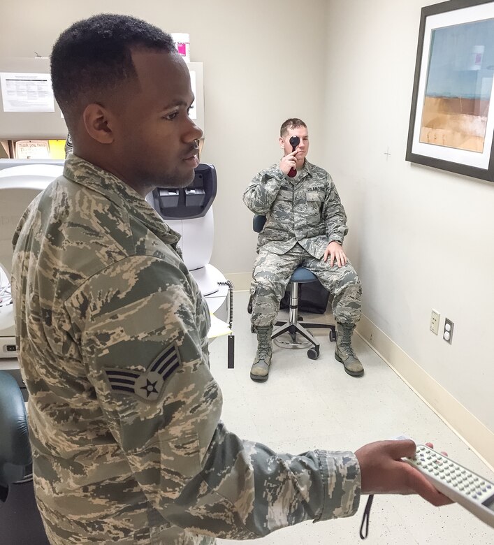 Senior Airman Aaron Obryant administers a vision test to Airman 1st Class Justin Gardner at the Joint Base Langley-Eustis, Va., clinic Aug. 6, 2016. Obryant is an optometry technician for the 920th Aerospace Medicine Squadron, a geographically separated unit of the 920th Rescue Wing at Patrick Air Force Base, Fla. (U.S. Air Force photo by 1st Lt. Anna-Marie Wyant)