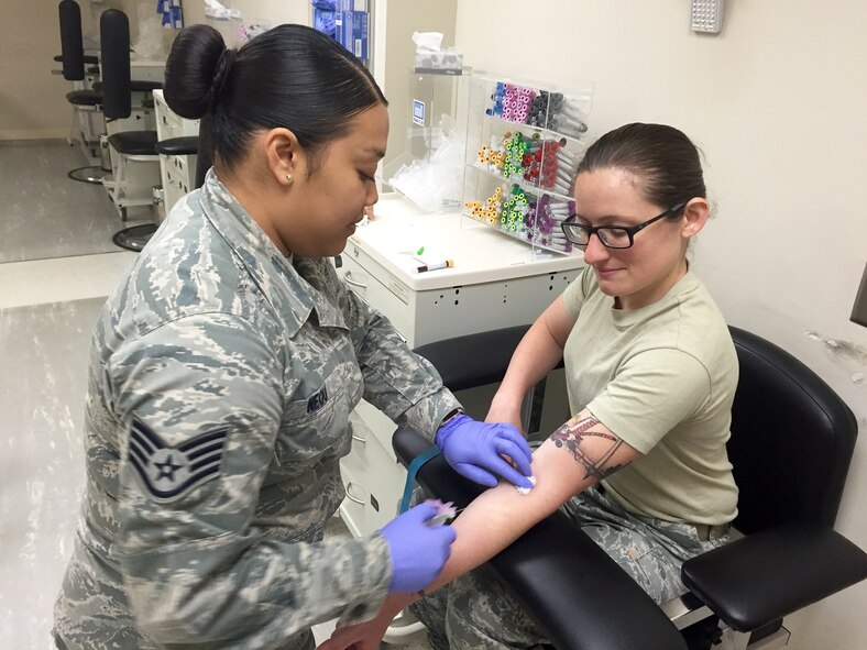 Staff Sgt. Khristy Neou carefully draws blood from Tech. Sgt. Ashley Lemley at the Joint Base Langley-Eustis, Va., clinic Aug. 6, 2016. Both Airmen are laboratory technicians at the 920th Aerospace Medicine Squadron, a geographically separated unit of the 920th Rescue Wing headquartered at Patrick Air Force Base, Fla. (U.S. Air Force photo by 1st Lt. Anna-Marie Wyant) 