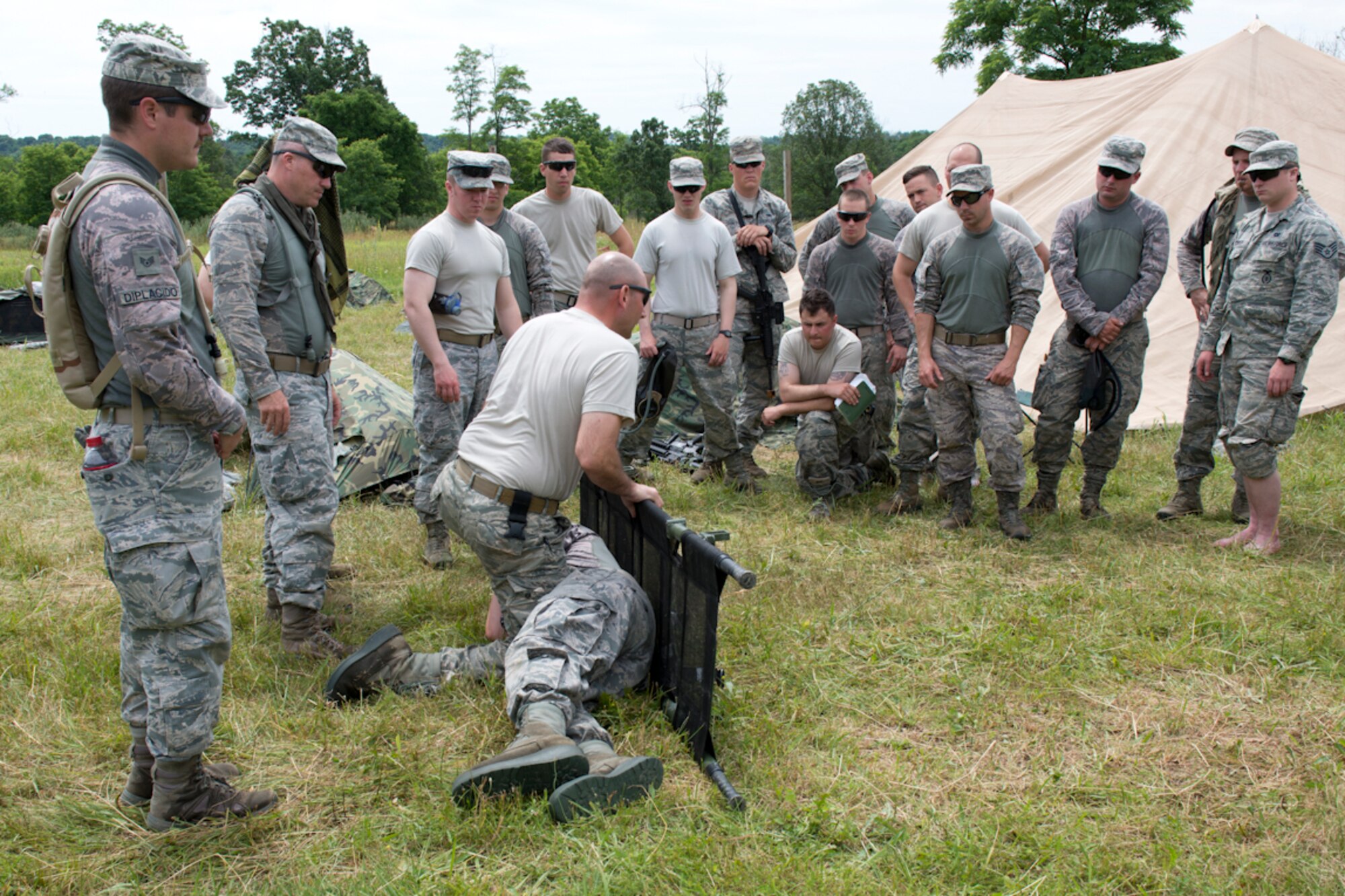 Tech. Sgt. Glenn Macher demonstrates litter techniques during the 167th Security Forces Squadron field training event in Gerrardstown, W.Va., June22. (U.S. Air National Guard photo by Senior Master Sgt. Emily Beightol-Deyerle)
