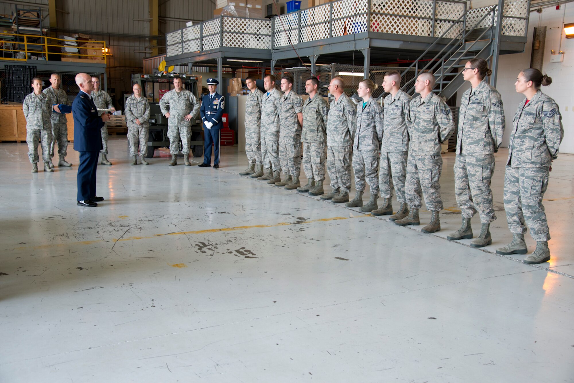 Col. Shaun Perkowski, commander of the 167th Airlift Wing, addresses newly certified Honor Guard members upon their completion of a forty-hour training course at the Martinsburg air base, July 22. (U.S. Air National Guard photo by Senior Master Sgt. Emily Beightol-Deyerle)