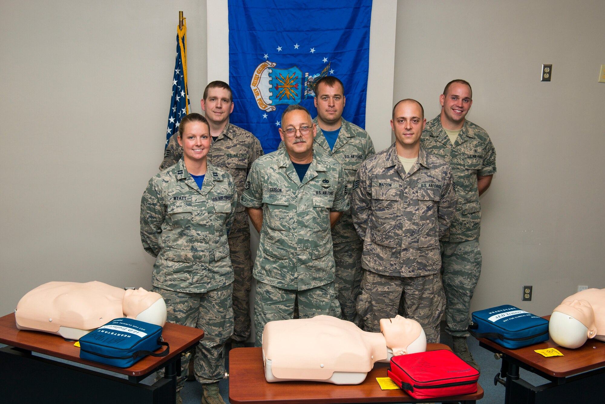 Three members of the 167th Airlift Wing in Martinsburg, W.Va., stand by instructors that taught them CPR, Aug. 6, 2016. Back L-R: Staff Sgt. Johnathen Guzik, a member of metals technology at the 167th, Staff Sgt. Justin Bird and Senior Airman Travis Sites, both CPR instructors at the 167th. Front L-R: Capt. Lori Wyatt, CPR instructor at the 167th, Staff Sgt. John Carson, a crew chief at the 167th, and Staff Sgt. Justin Watson a member of metals technology at the 167th. Guzik, Carson and Watson performed CPR on victims of a crash on I-81 after leaving drill on June 12, 2016. Wyatt, Bird and Sites instructed a CPR class that Guzik and Watson attended the day before. (U.S. National Guard photo by Staff Sgt. Jodie Witmer)