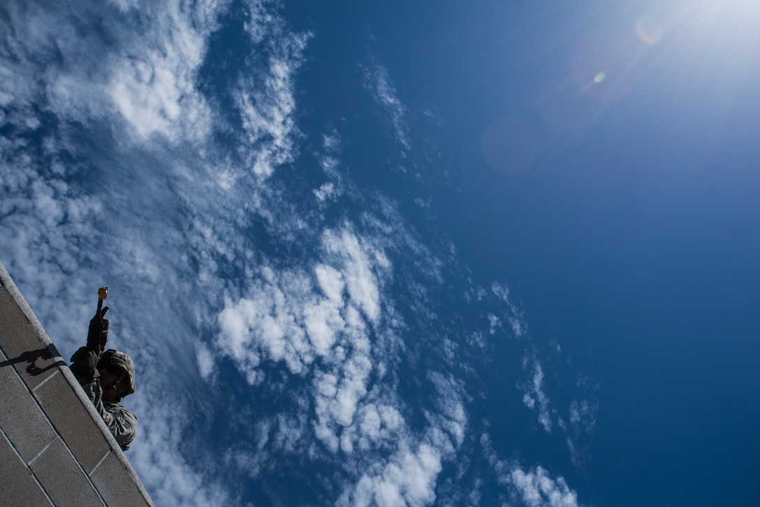 An Airman with the 137th Security Forces Squadron engages a target at Camp Gruber Training Center near Braggs, Okla., Aug. 3, 2016.  Approximately 40 members of the 137 SFS completed annual training from July 29 to Aug, 5, 2016. Airmen participated in extensive training exercises including close combat, weapons, military operations on urban terrain and navigation. (U.S. Air National Guard photo by Senior Airman Tyler Woodward/Released)