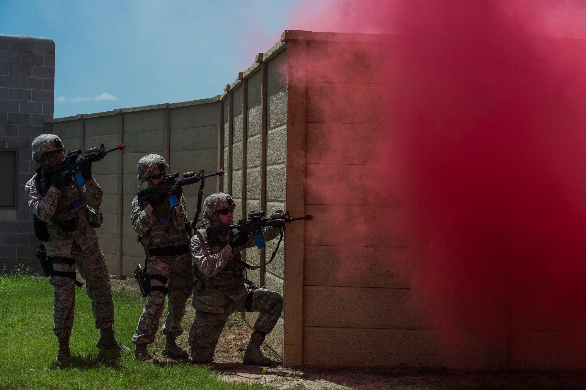 Airmen with the 137th Security Forces Squadron engage a target at Camp Gruber Training Center near Braggs, Okla., Aug. 3, 2016.  Approximately 40 members of the 137 SFS completed annual training from July 29 to Aug, 5, 2016. Airmen participated in extensive training exercises including close combat, weapons, military operations on urban terrain and navigation. (U.S. Air National Guard photo by Senior Airman Tyler Woodward/Released)