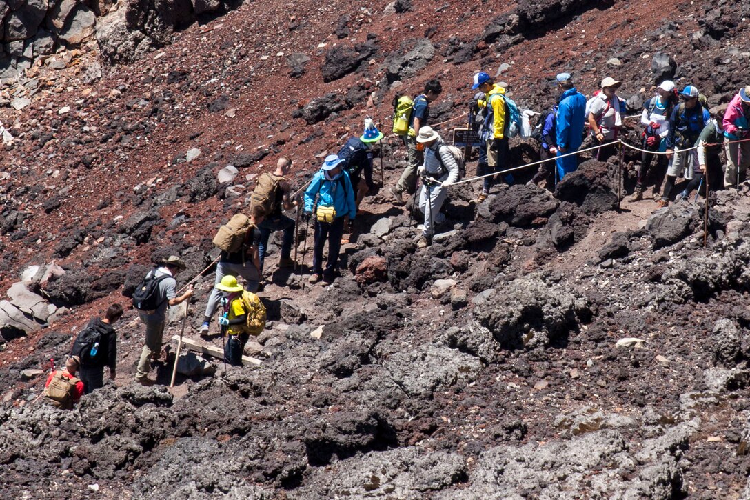 U.S. Marines with Marine Wing Support Squadron (MWSS) 171, based out of Marine Corps Air Station Iwakuni, hiked up Mount Fuji, Japan, as part of a unit activity July 31, 2016. Marines within the squadron first conquered Mount Fuji with a 3,776 meter climb to the peak. Marines bought ‘Kongo-Tsue’ walking sticks and had stamps burned onto them, which signified the location and altitude throughout 10 stations located up the trail. (U.S. Marine Corps photo by Lance Cpl. Aaron Henson)