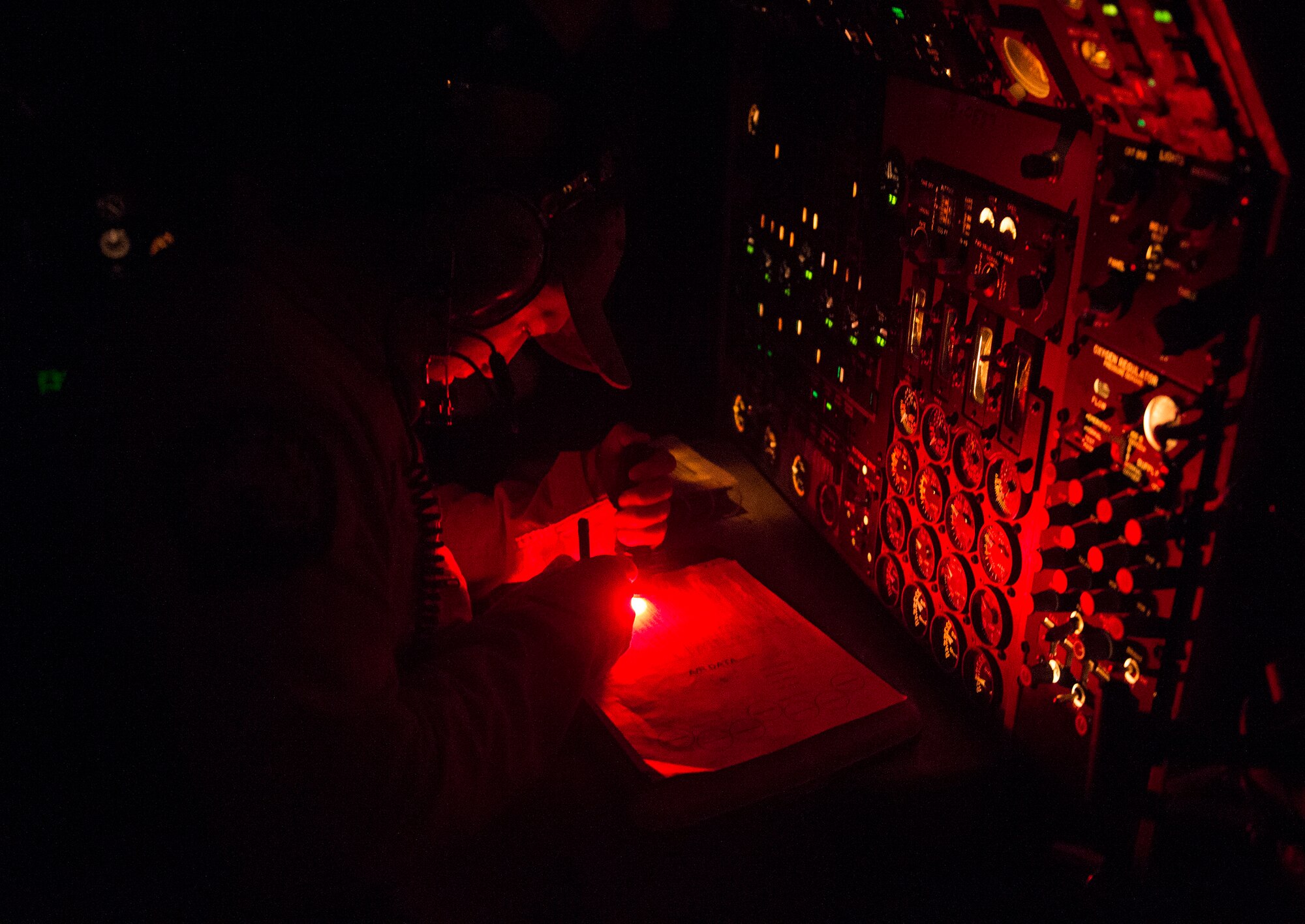 An E-3 Sentry flight engineer assigned to the 968th Expeditionary Airborne Air Control Squadron monitors aircraft systems during a night mission in the CENTCOM area of responsibility July 28, 2016. Being airborne and mobile allows the 968 EAACS to have a line-of-sight on other aircraft and provides a low-level look that is crucial to battle management and surveillance in the AOR. (U.S. Air Force photo by Tech. Sgt. Chad Warren/released)