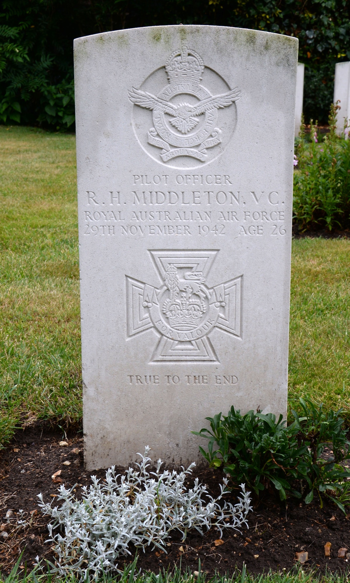Pilot Officer Rawdon Hume Middleton’s grave rests in the churchyard of St. John's, Aug. 4, 2016, in Beck Row, England. Middleton died a war hero and was awarded a posthumous Victoria Cross. (U.S. Air Force photo by Gina Randall)