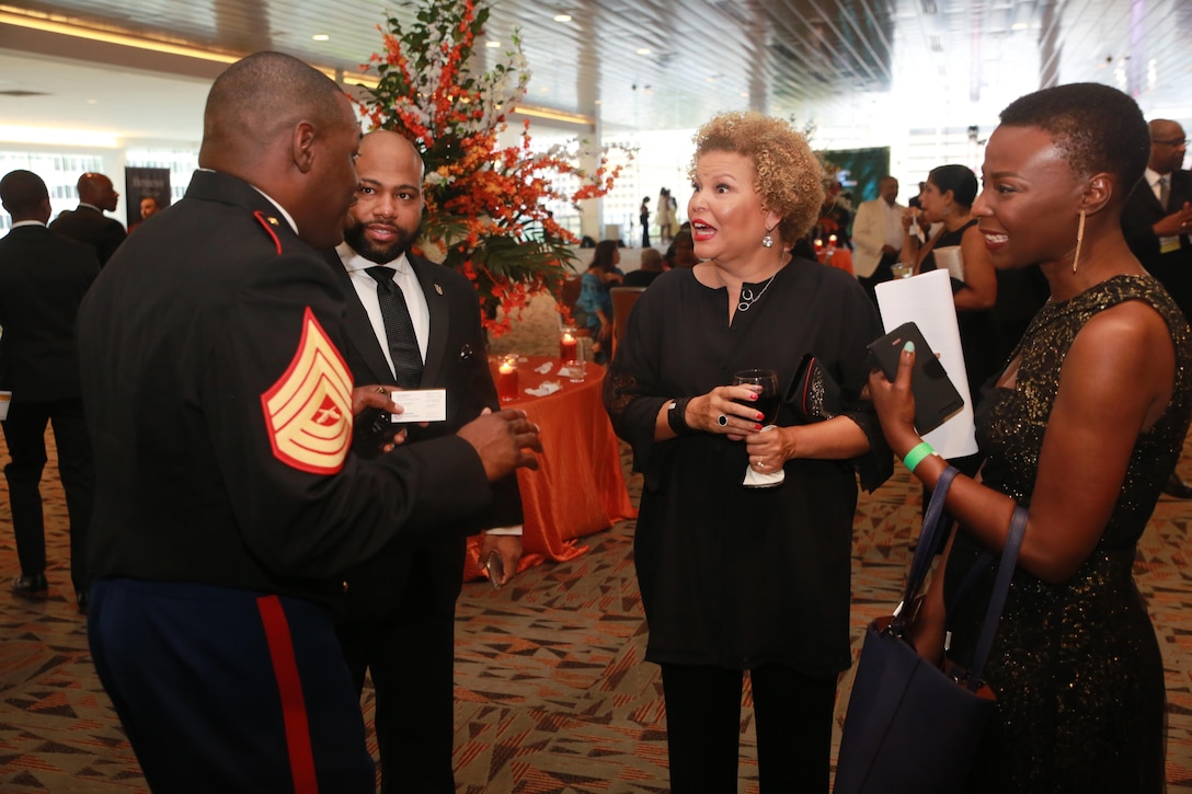 Master Sergeant Damian Cason speaks to Debra Lee, CEO of BET at the 2016 National Urban League Conference in Baltimore, MD, August 5, 2016. Cason currently serves as the Diversity Chief at Marine Corps Recruiting Command.