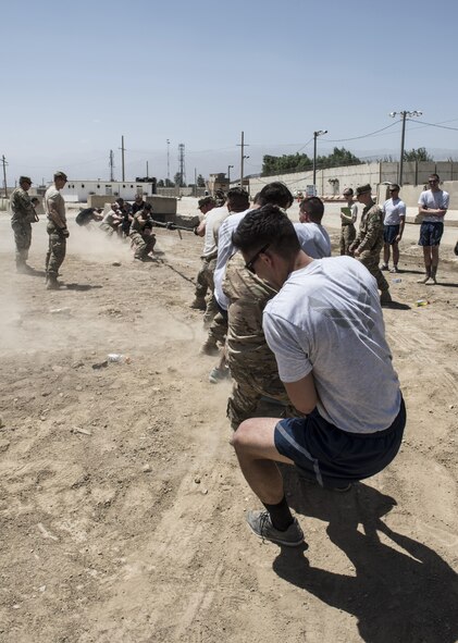U.S.Air Force security forces and U.S. Army military police members compete in an all or nothing tug-of-war, Bagram Airfield, Afghanistan, Aug. 7, 2016. The teams used their strength, endurance and team work to overcome one another. (U.S. Air Force photo by Tech. Sgt. Tyrona Lawson)
